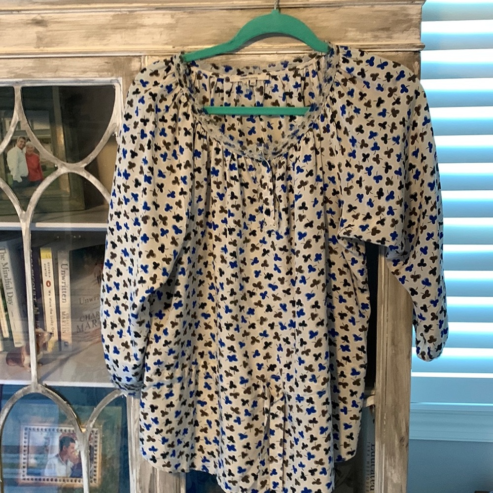 Silk top with drawstring at waist.